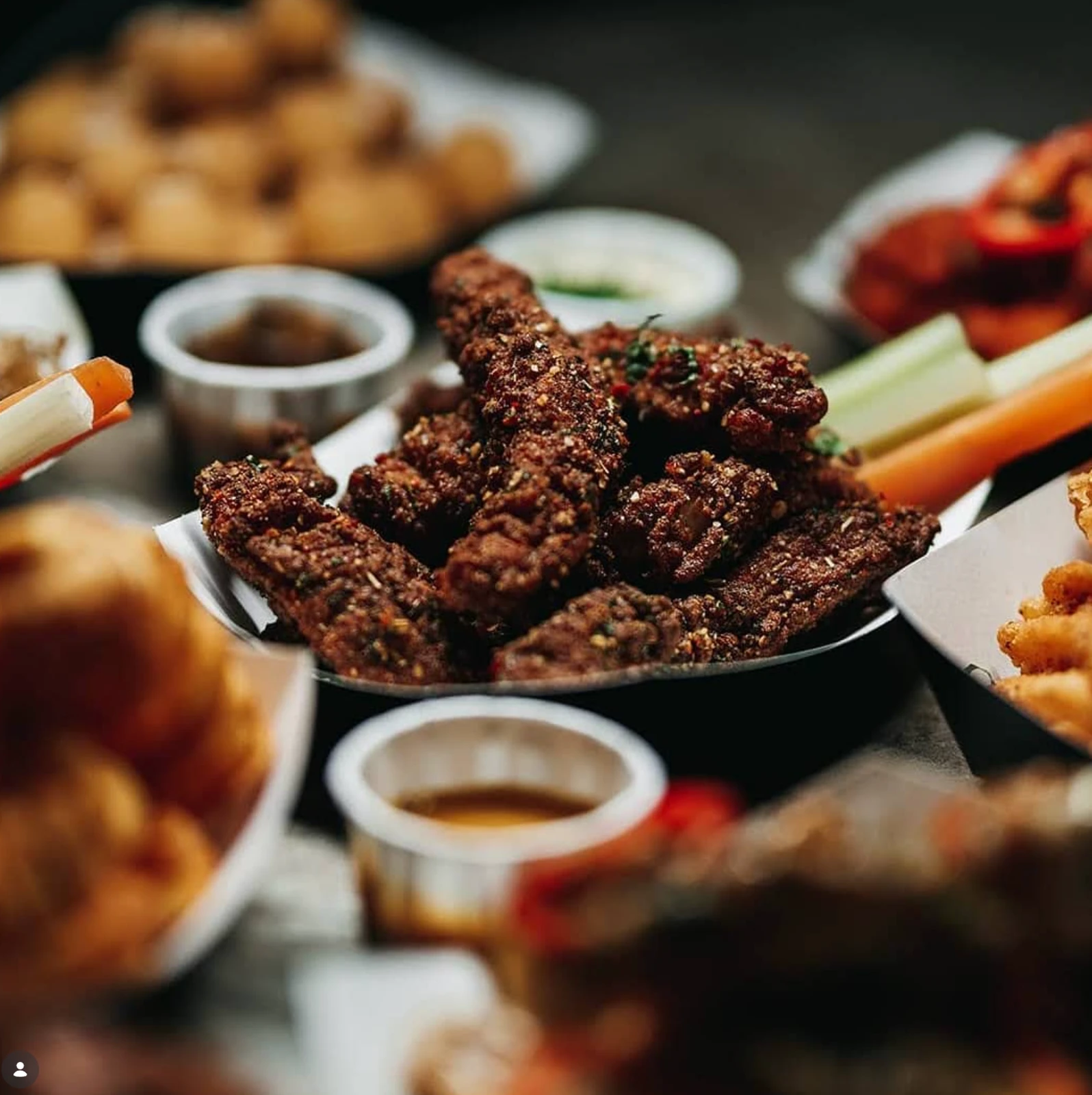 A spread of saucy wings and sides