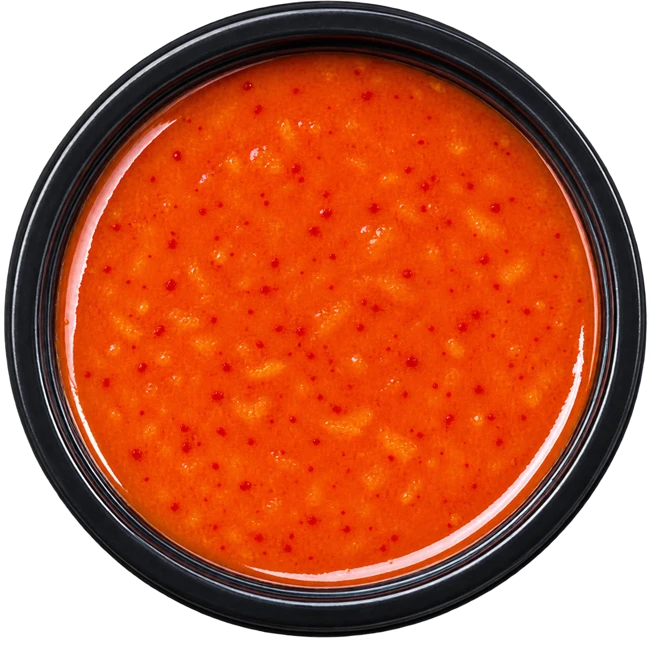 Overhead pot of scotch bonnet<br>& pineapple sauce